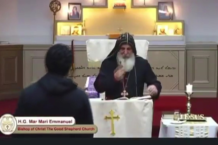a bishop at an assyrian orthodox church during a service before a person approaches and allegedley stabs him