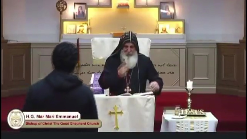 a bishop at an assyrian orthodox church during a service before a person approaches and allegedley stabs him