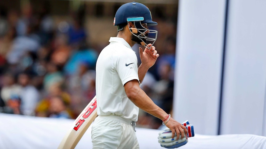 India captain Virat Kohli walks off after losing his wicket against Australia in the second Test.