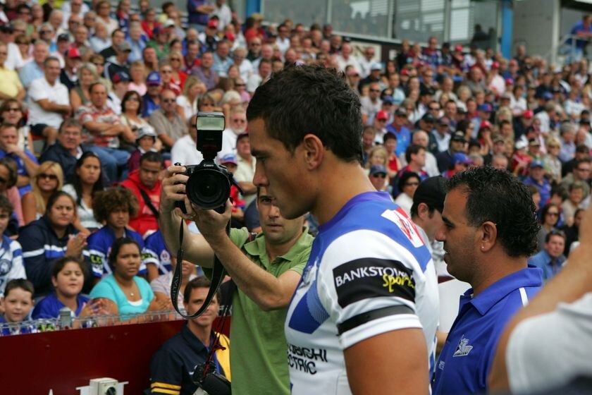 Sonny Bill Williams walks with his head down.