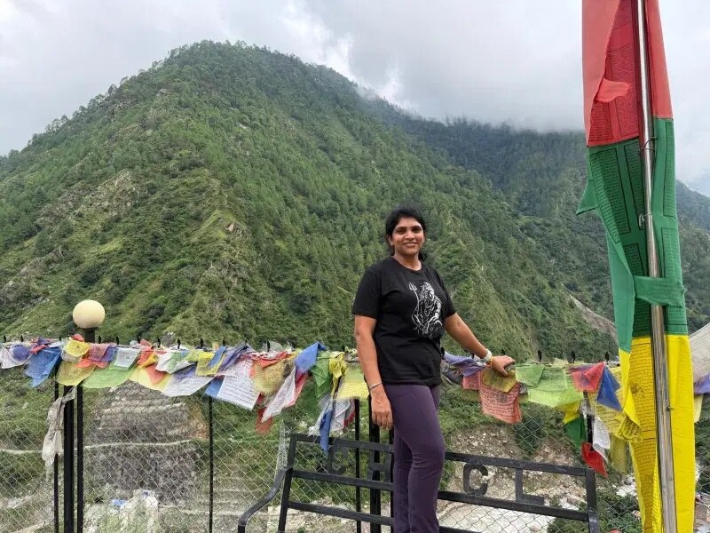 woman near green mountains.