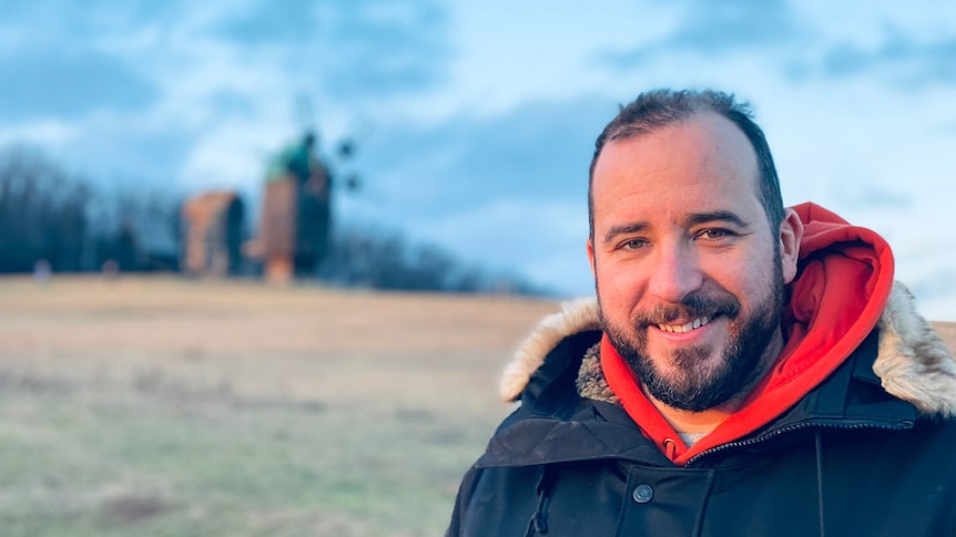 A picture of a man smiling. 