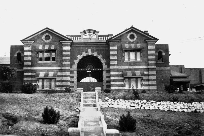 A historical black and white picture of the exterior of Boggo Road Gaol from 1936