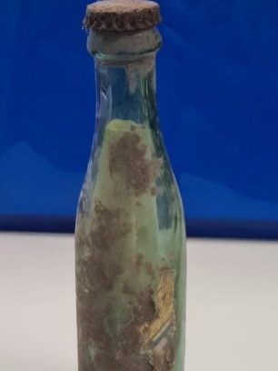 A glass bottle with a note in at. 