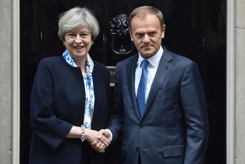 British Prime Minister (left) shakes hands with EU Council President Donald Tusk (right) in front of 10 Downing Street