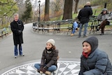 Visitors take photographs at the Imagine marble mosaic in Strawberry Fields