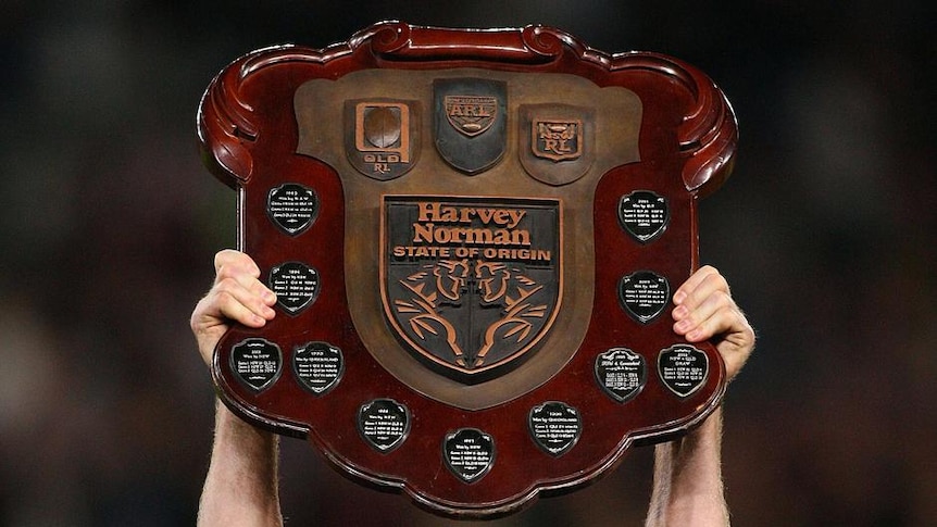 Queensland captain Darren Lockyer holds up the State of Origin shield for the sixth and final time.