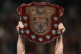 Darren Lockyer lifts the Origin shield for the sixth straight year.