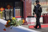 Flowers are seen near the scene of a shooting.