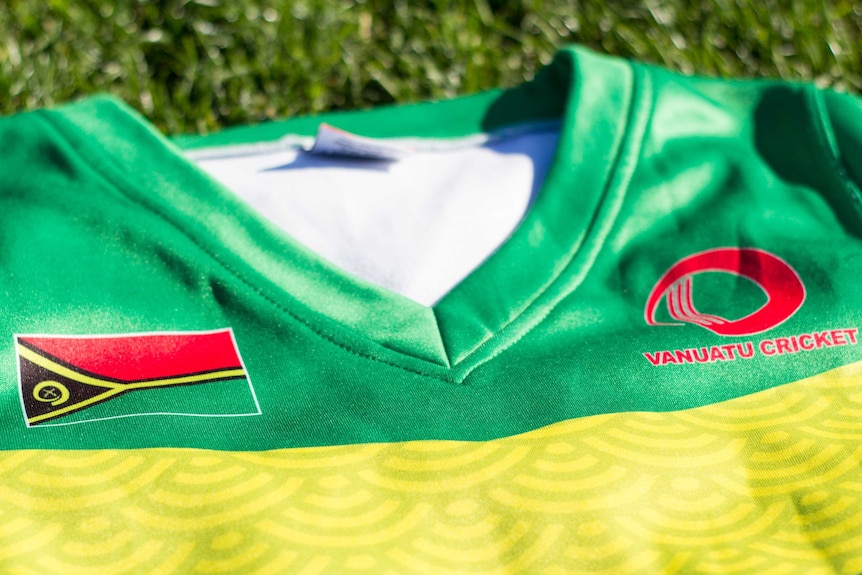 A Vanuatu cricket shirt lies on grass.