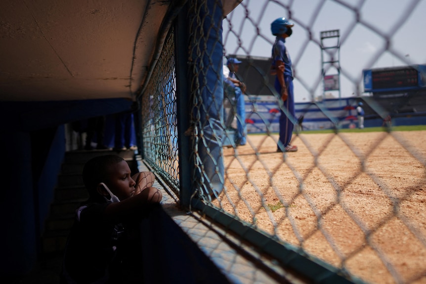 A child watches a baseball match between Industriales and Artemisa at the Latinoamericano Stadium in Havana.