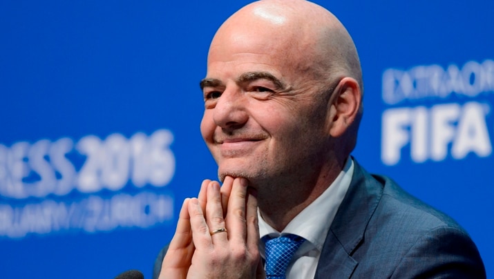 Gianni Infantino smiles during a press conference.