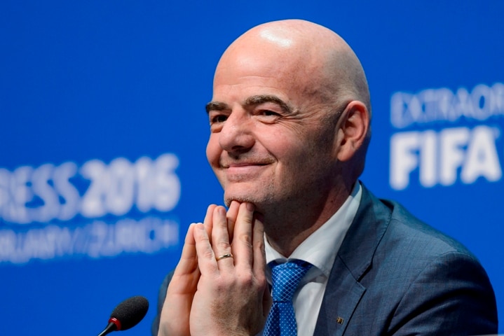 Gianni Infantino smiles during a press conference.