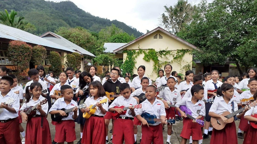 Indonesian children playing ukulele