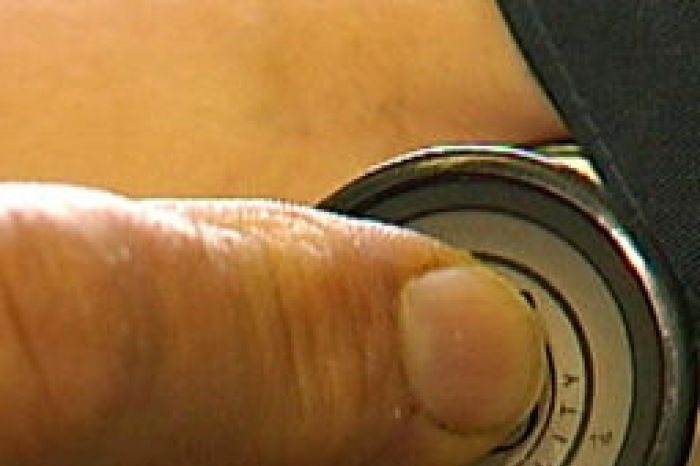 A doctor holds a stethoscope to a patient's arm (ABC News)