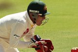 Brad Haddin catching ball behind stumps, Test cricket