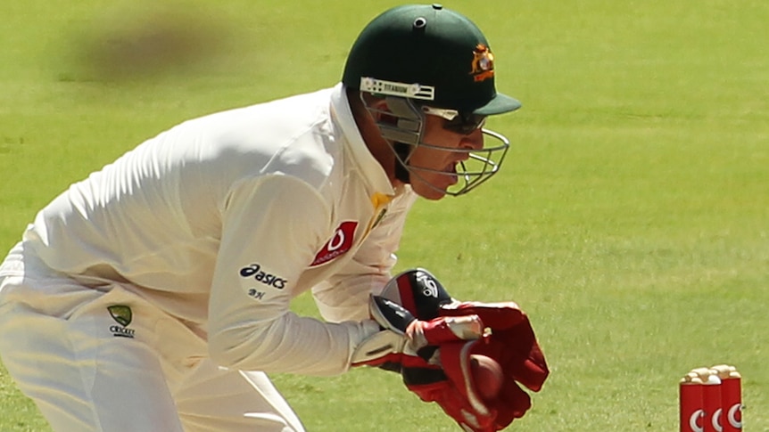 Brad Haddin catching ball behind stumps, Test cricket