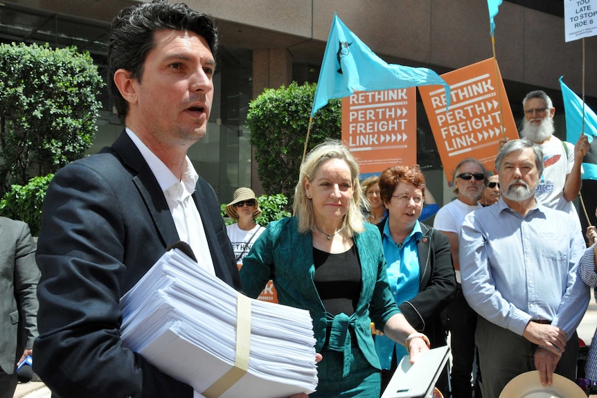 Greens Senator Scott Ludlam joins a rally outside the Prime Minister's Perth office.