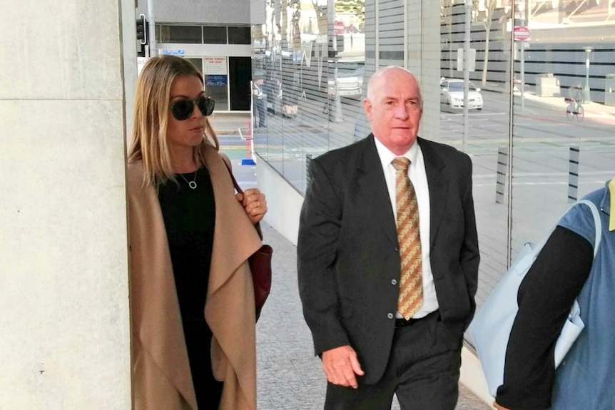 Gordon Nuttall walking into Supreme court building in Brisbane