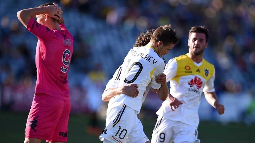 The Mariners' Mitchell Duke (L) reacts as Michael McGlinchey celebrates his goal for Wellington.