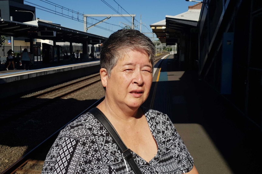 Self-funded retiree Sue Raynes standing on the platform at Panania railway station