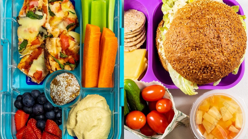 Close ups of two lunchboxes with raw veges, dips, cheese and whole grain breads.