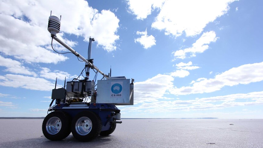 CSIRO Robot on wheels on flat salt pan in Australian outback