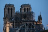 Fire fighters spray water on the Notre Dame cathedral in the early morning after the fire.