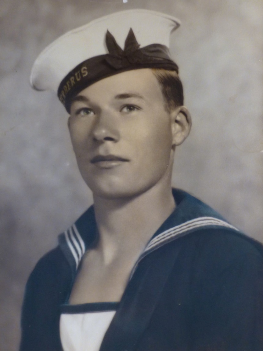 Official portrait of officer Jack Bartlett, wearing his sailor hat and naval uniform. 