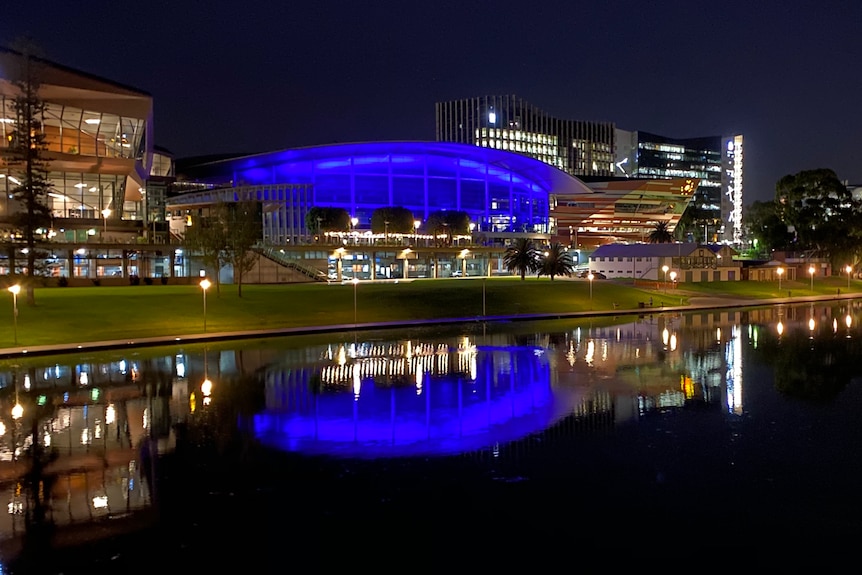 Adelaide Convention Centre, overlooking the River Torrens, is lit in blue in tribute to late Chief Superintent Joanne Shanahan.