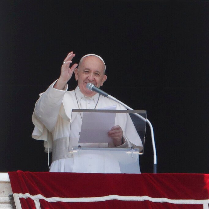 Pope Francis delivering his blessings and speech from his window overlooking St Peter's Square.