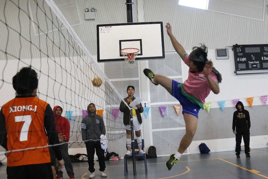 A player strikes a ball with his foot.