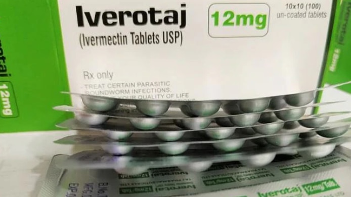 Blisters of tablets in front of a box for the drug Ivermectin