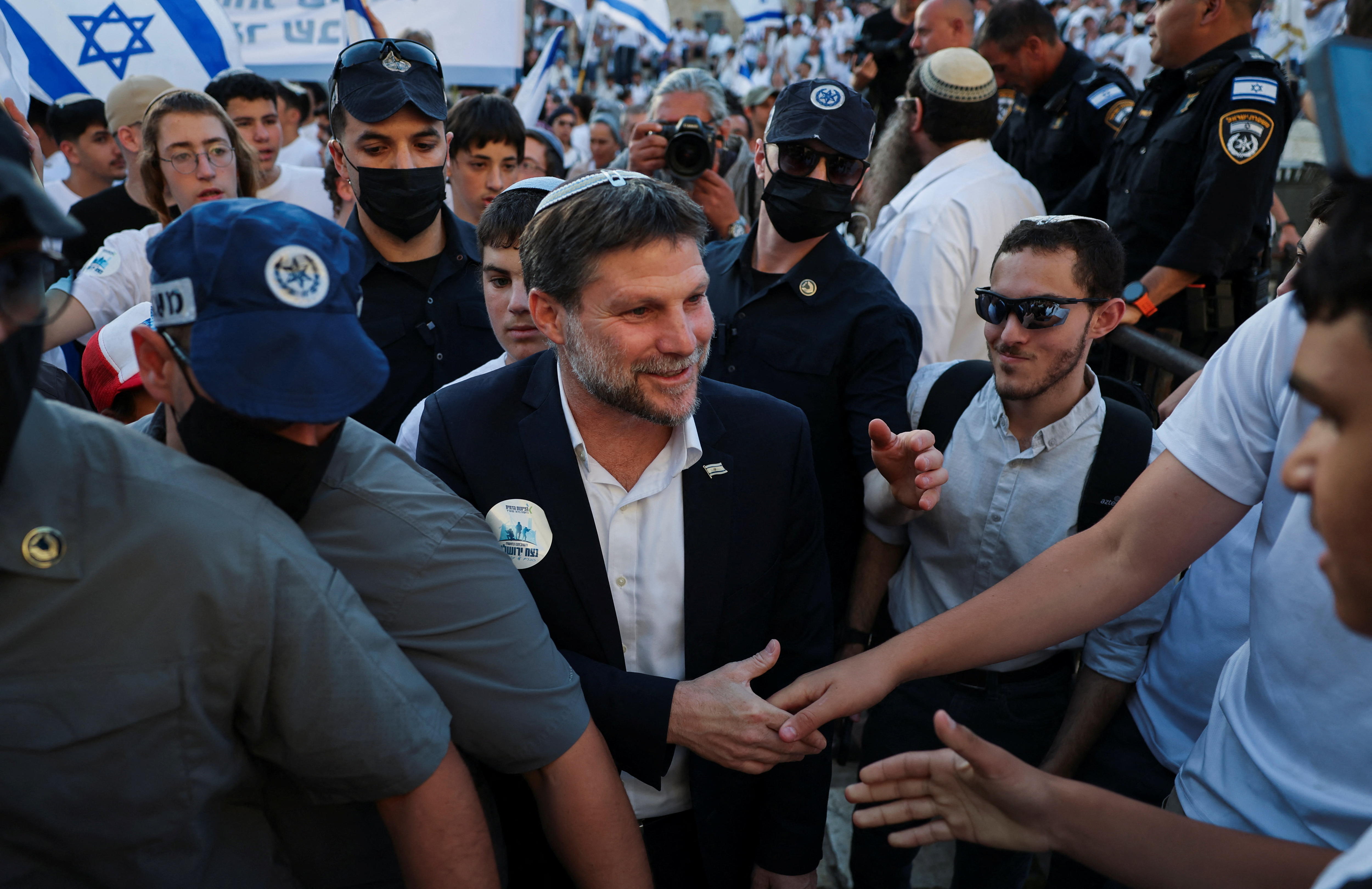 Bezalel Smotrich in a crowd of supporters. 