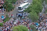 Riot involving Uighurs and Chinese security forces on a street in Urumqi