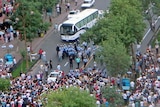 Riot involving Uighurs and Chinese security forces on a street in Urumqi