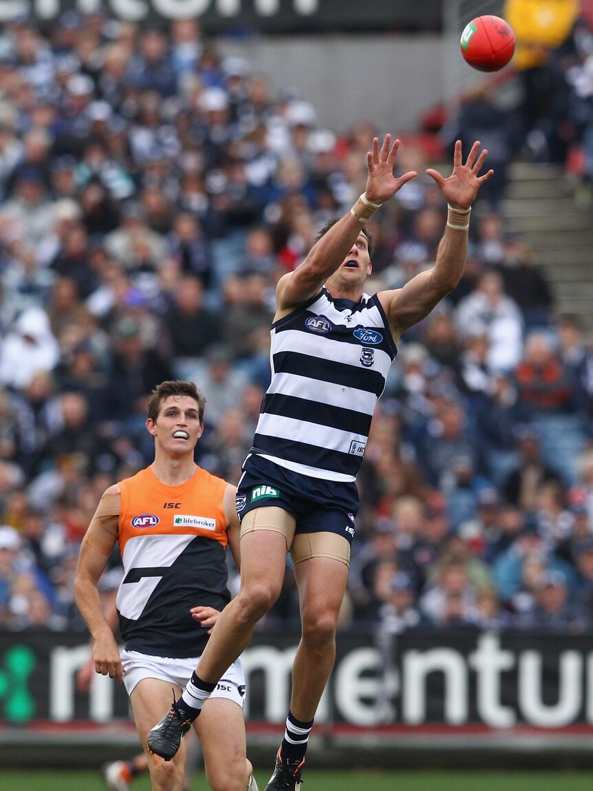 Outjumping the Giants ... Harry Taylor takes a mark in front of GWS's Phil Davis.