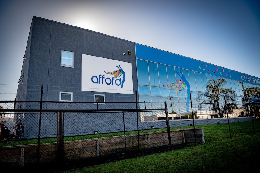 A multi-storey building with 'Afford' written on a sign 