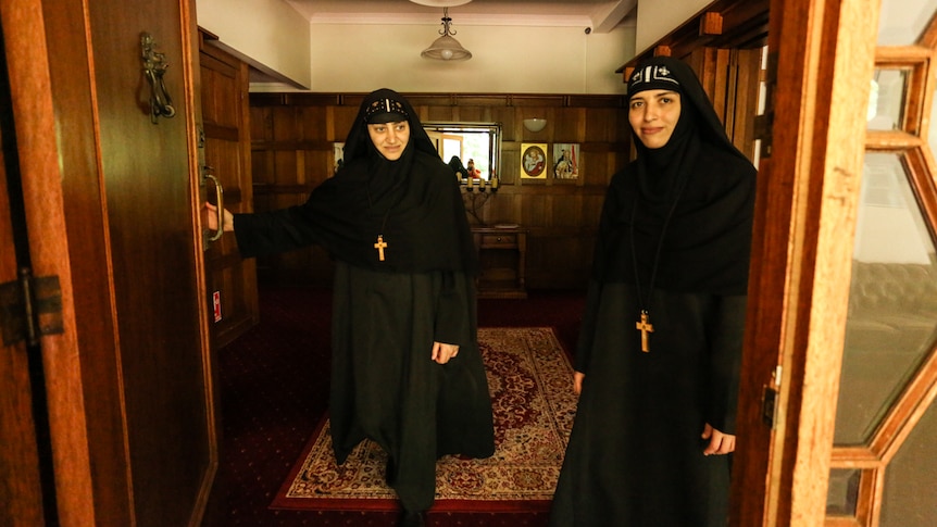 Mother Antonia (left) and Mother Veronica at the entrance to the Woodend 1920s manor that is now a Coptic monastery for nuns.