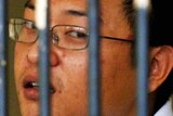 Andrew Chan behind bars