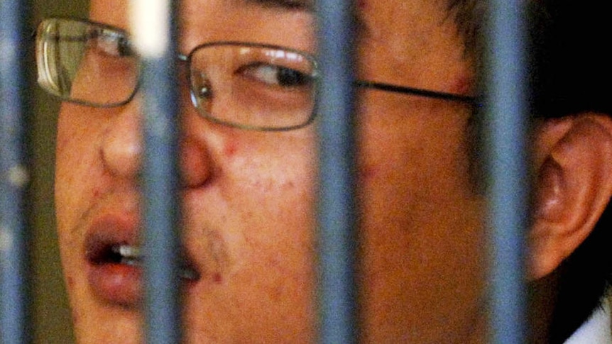 Andrew Chan behind bars