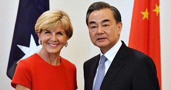 Julie Bishop and China's Foreign Minister Wang Yi shake hands.