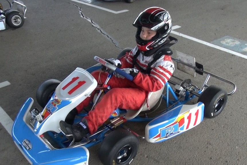 A boy in a go-kart.
