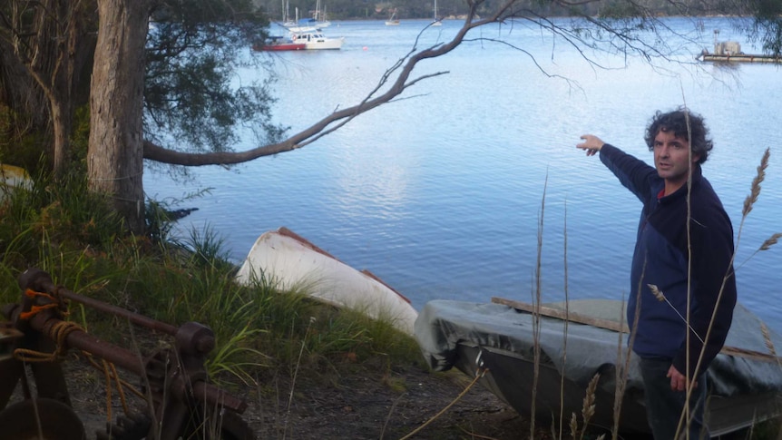 Ben Boyle pointing to where he grew up in Deep Bay, southern Tasmania taken on July 31, 2014.