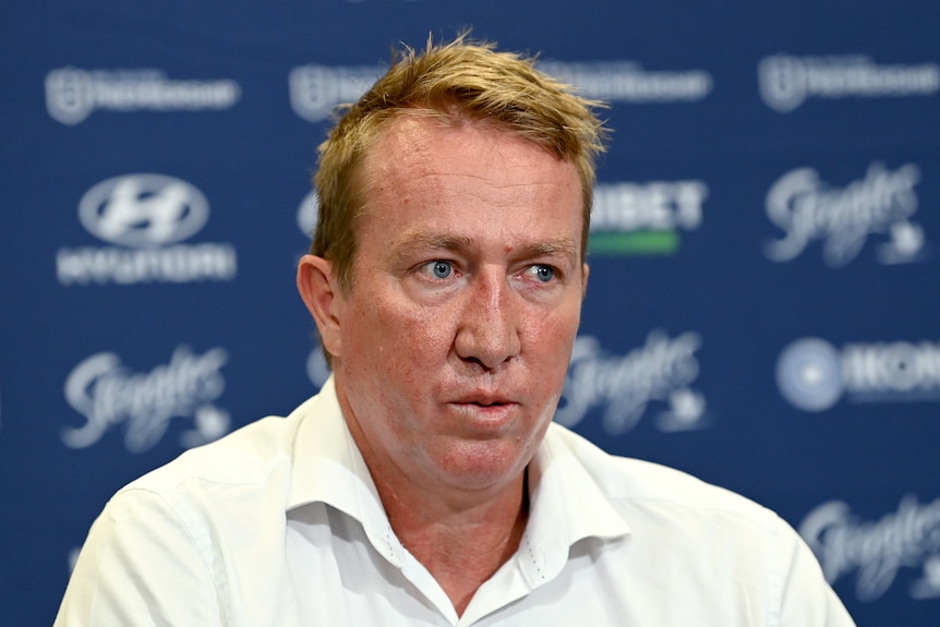 Trent Robinson speaks at a press conference