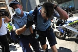 Injured police officer in anti-lockdown protest