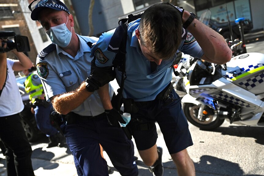 Injured police officer in anti-lockdown protest