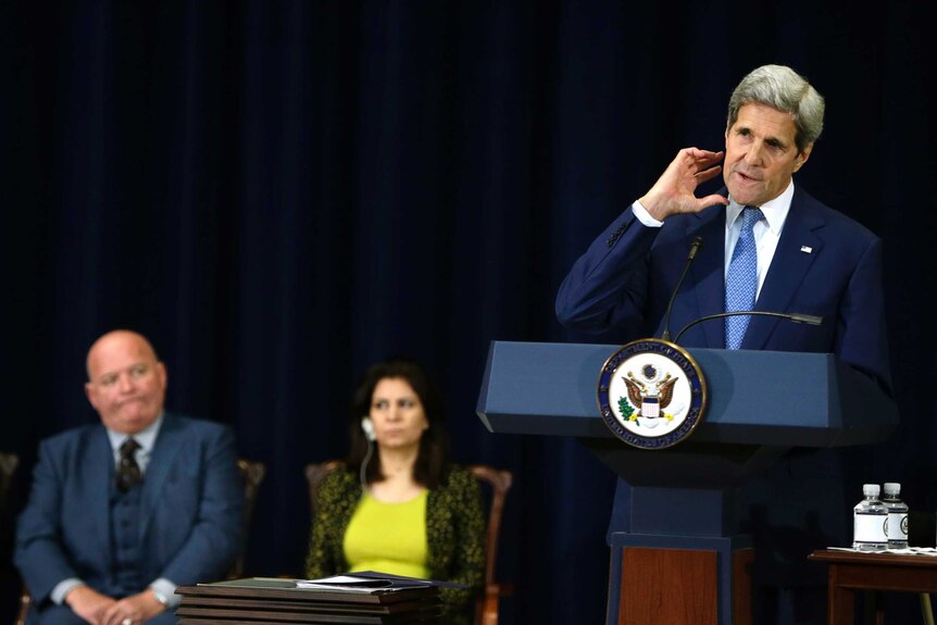 US Secretary of State John Kerry (R) announcing the 2015 TIP report last year.
