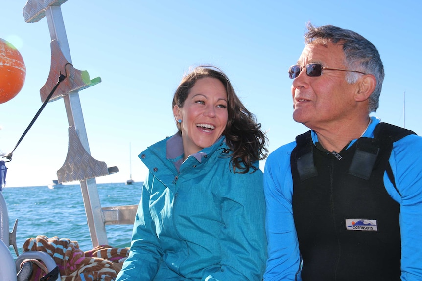 Researchers Pang Quong and Sheree Marris sitting on the deck of the boat in Port Phillip Bay.