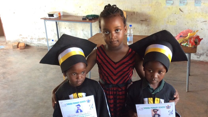 Siya Bhebhe with two graduates